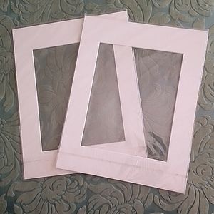 A pair of 11x14 picture mats in off-white. Brand new in plastic sheaths.
